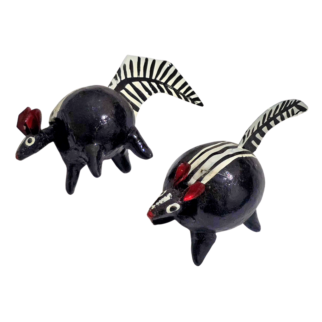 Bobble-head resin pig and skunk - made by an artisan from the Peruvian Amazon - Amazon Ecology