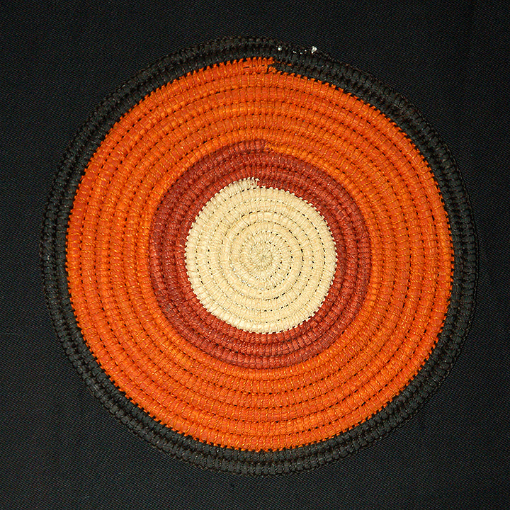 Woven hot pad (trivet) and center piece with earth-tone bands - Amazon Ecology