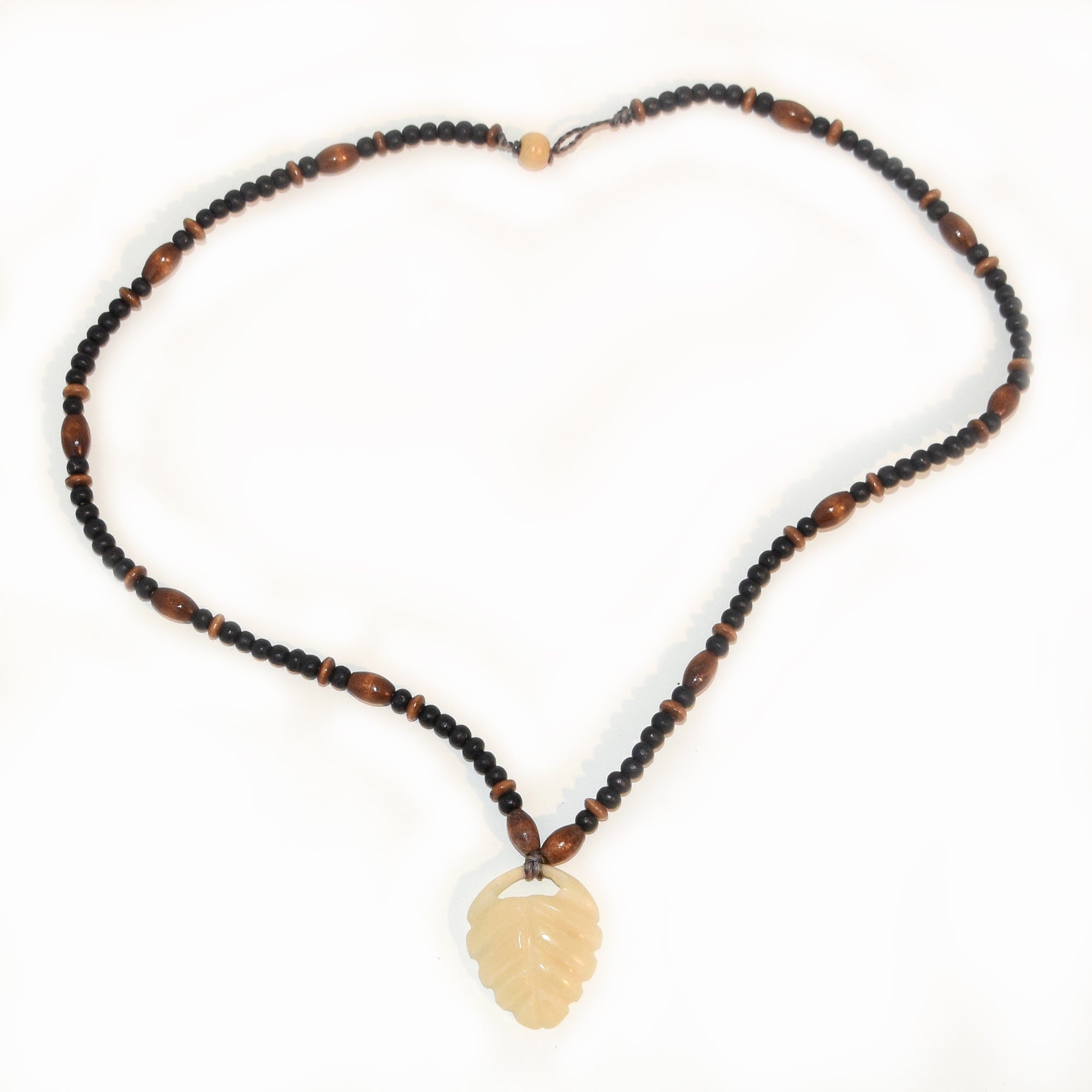 Carved tagua palm nut pendant and wooden bead necklace - made by an artisan from the Peruvian Amazon - Amazon Ecology